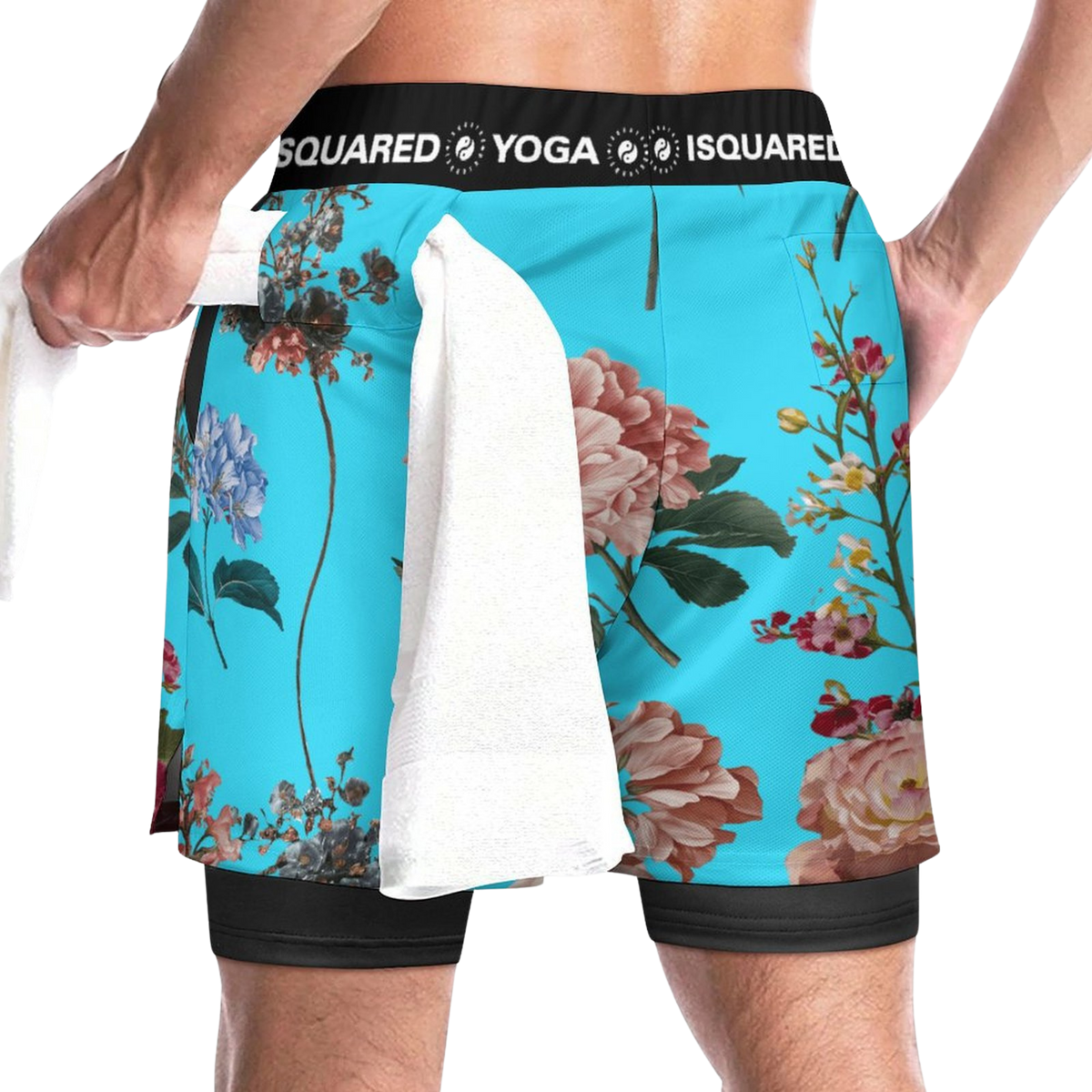 Compression yoga shorts in vibrant turquoise with floral print, featuring a black elastic waistband and a towel tucked in.