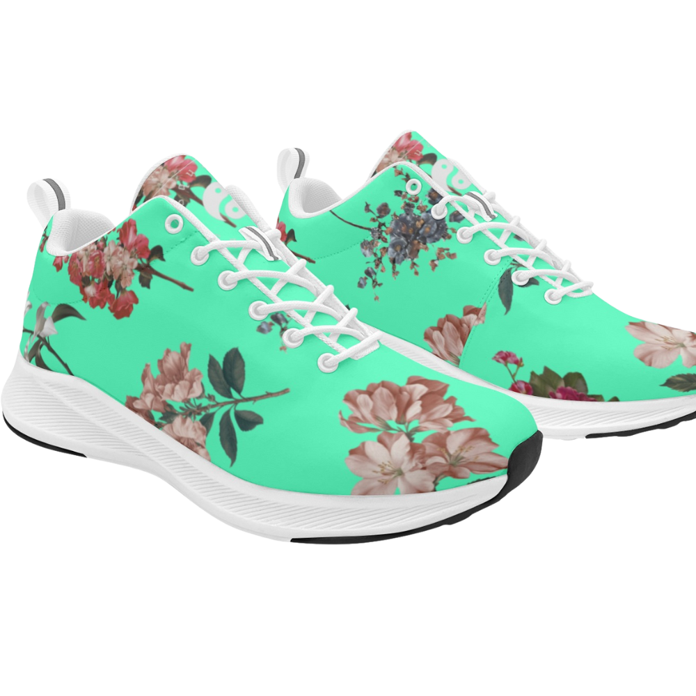 Breathable turquoise sneakers with floral patterns, featuring white laces and a black rubber sole.
