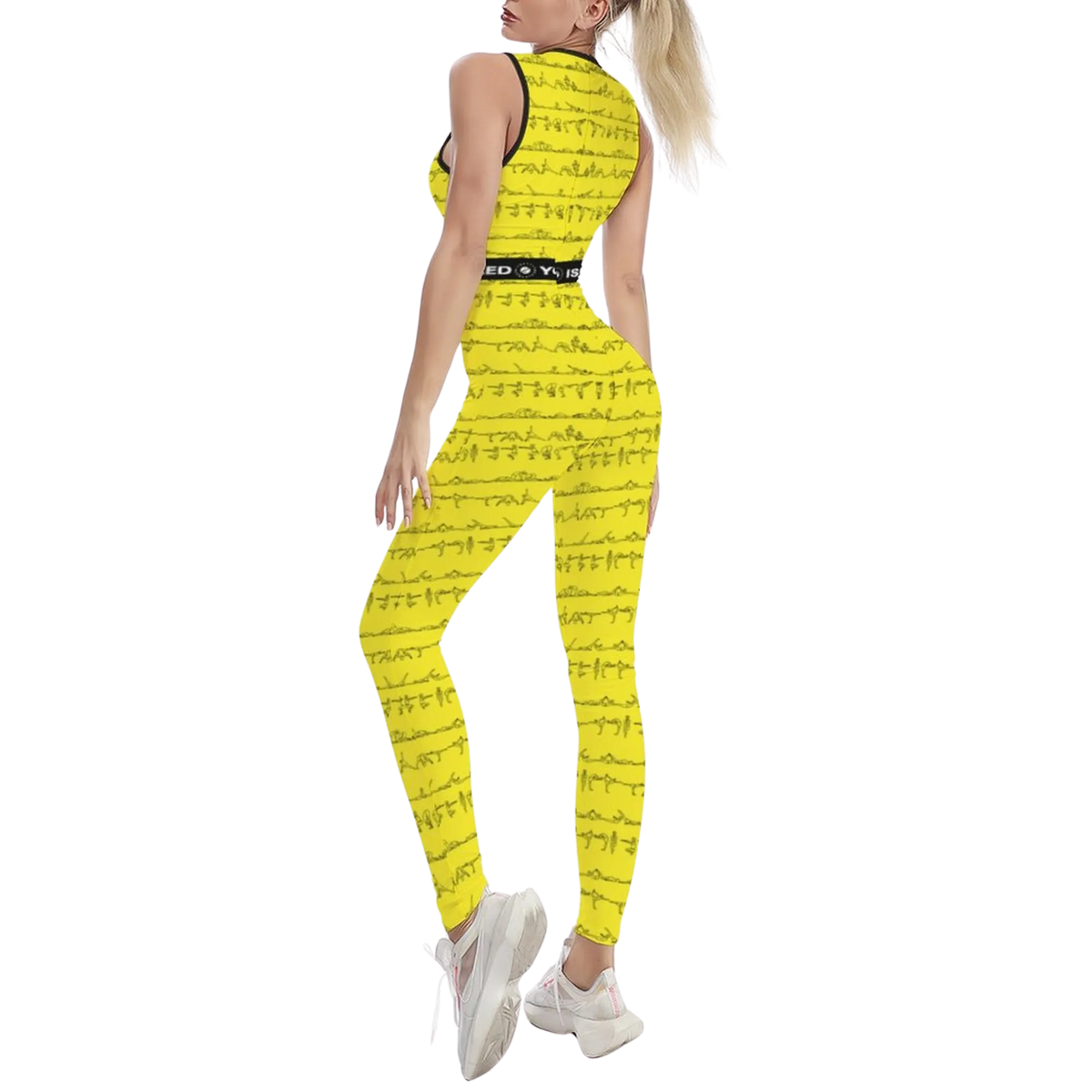 Sleeveless yellow jumpsuit featuring a unique print of Bikram yoga postures, styled with white sneakers.