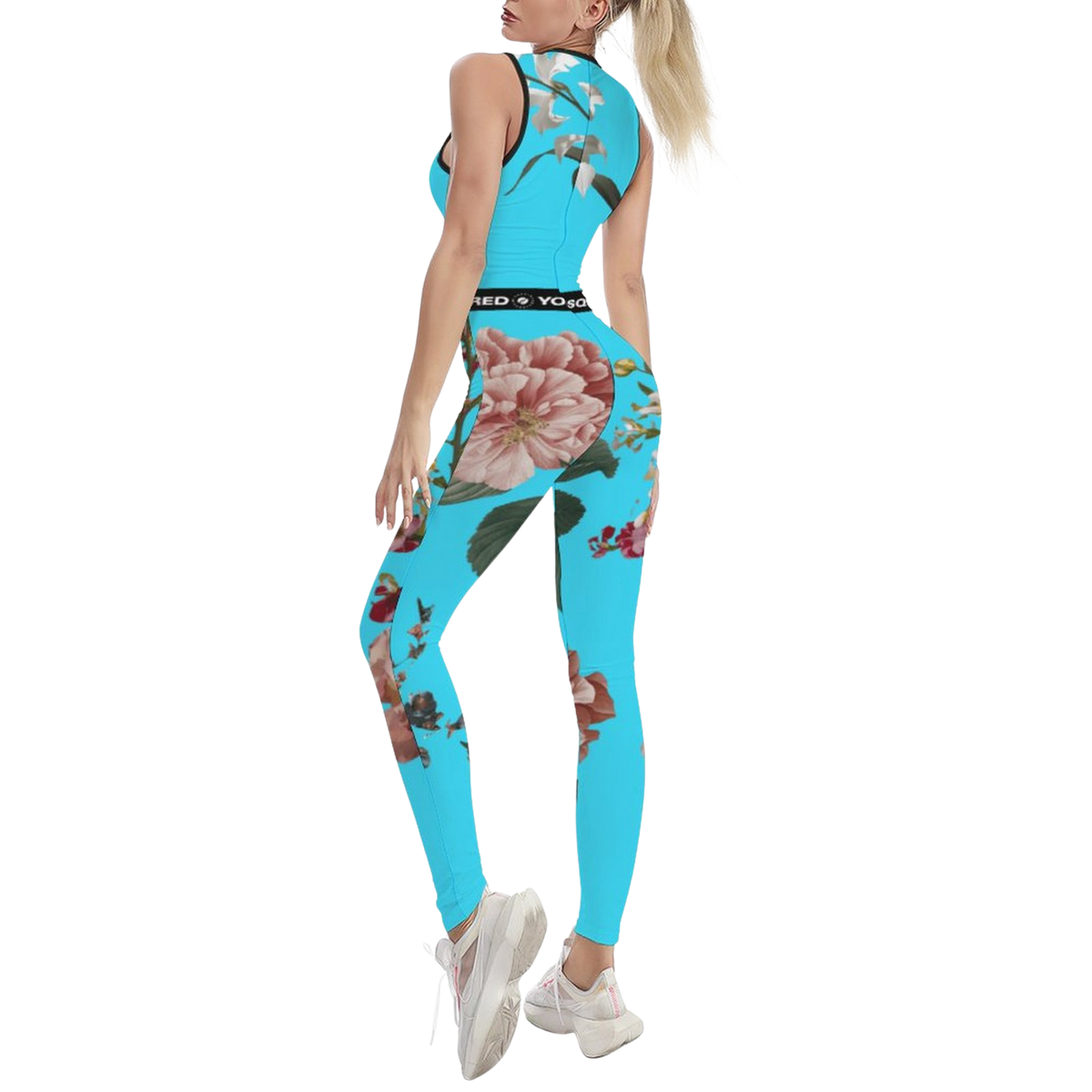 Sleeveless turquoise jumpsuit with botanical floral prints, featuring a body-contouring fit and a stylish back design.