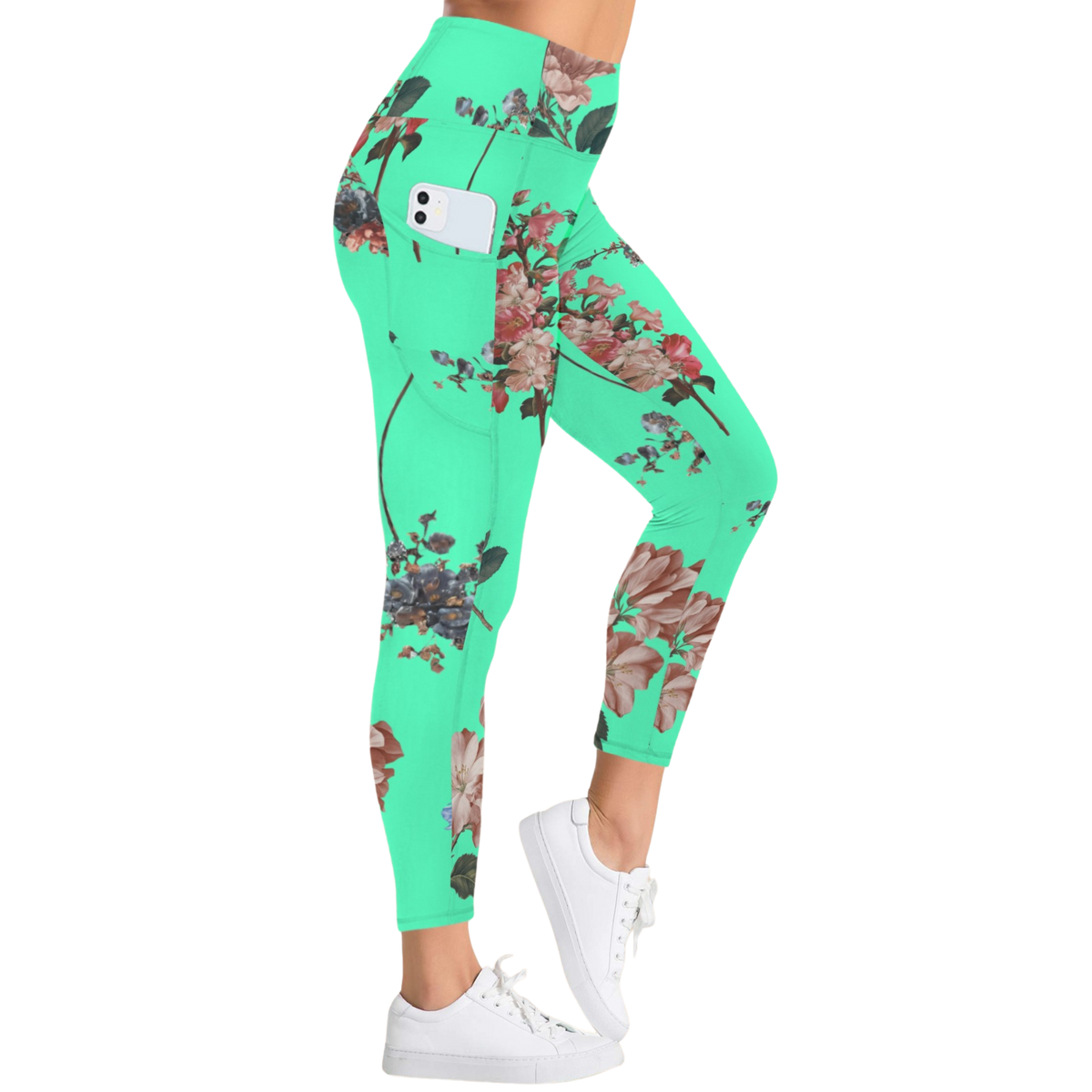 Vibrant turquoise pocket leggings with floral print, high-rise fit, worn with white sneakers.