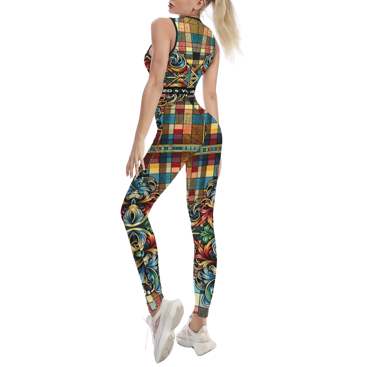 Sleeveless iSquared Jumpsuit in a colorful plaid and floral design, worn by a model with white sneakers.