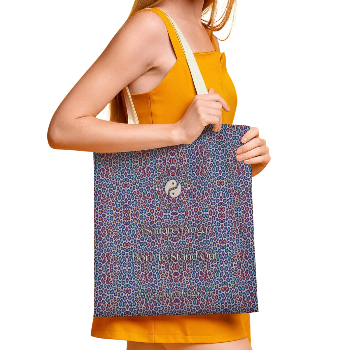 Colorful Wild Leopards tote bag featuring a striking pattern, held by a model wearing a yellow sleeveless top.