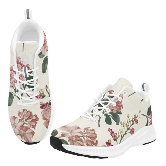 White sneakers with a floral botanical print in pink and green. Features a white sole and lace-up front design.