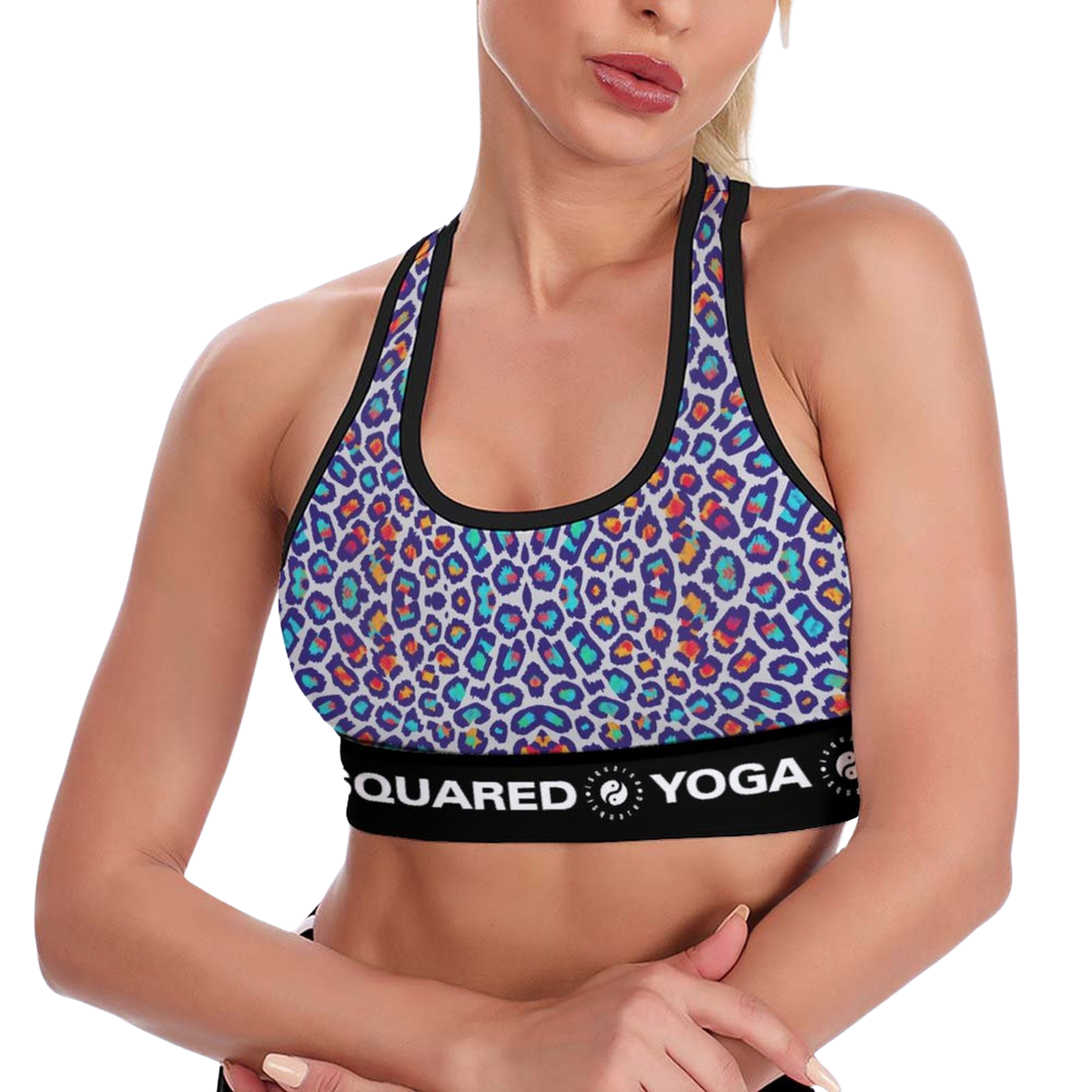 Dynamic Lift Sports Bra in vibrant leopard print features a rainbow of colors, with a black band displaying "iSquared Yoga.