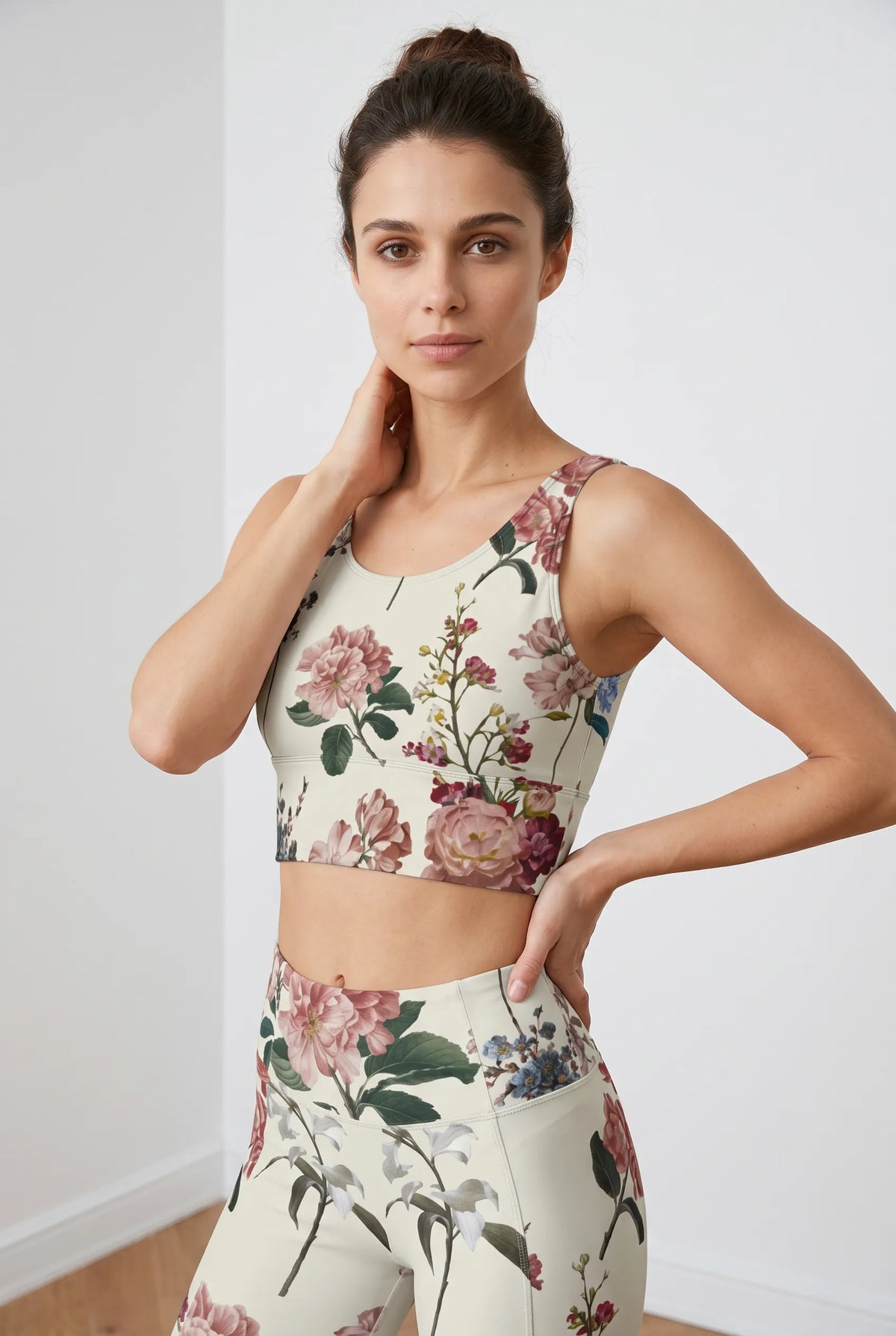 Cropped floral crop top featuring a U-back design, modeled with high-waisted floral leggings against a light background.