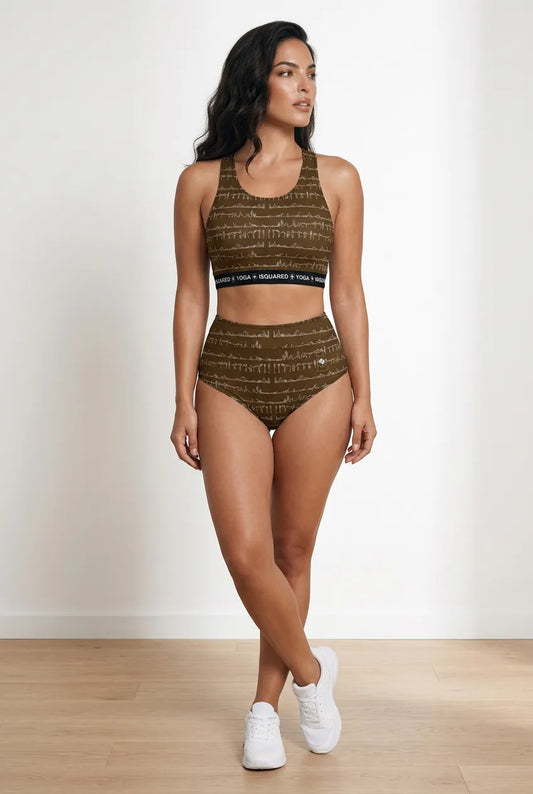 Bikram Ember hot yoga bikini set in earthy tones with a patterned crop top and high-waisted bottoms, worn with white sneakers.