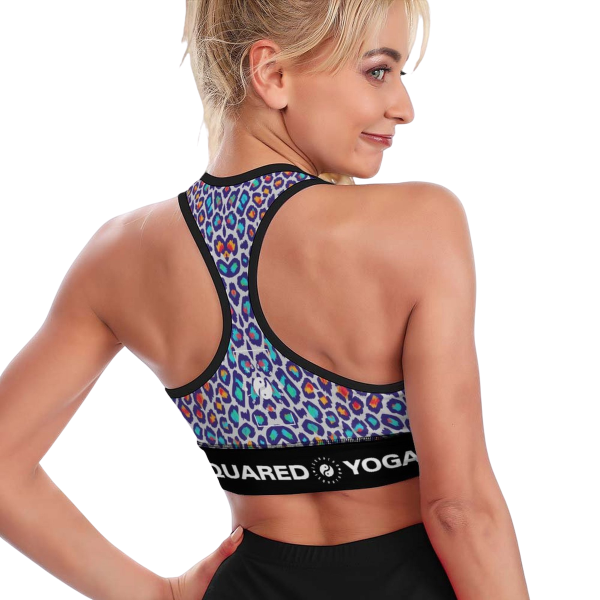 Dynamic Lift Sports Bra features a vibrant multicolored leopard print with a black band, showcasing an X-back design.