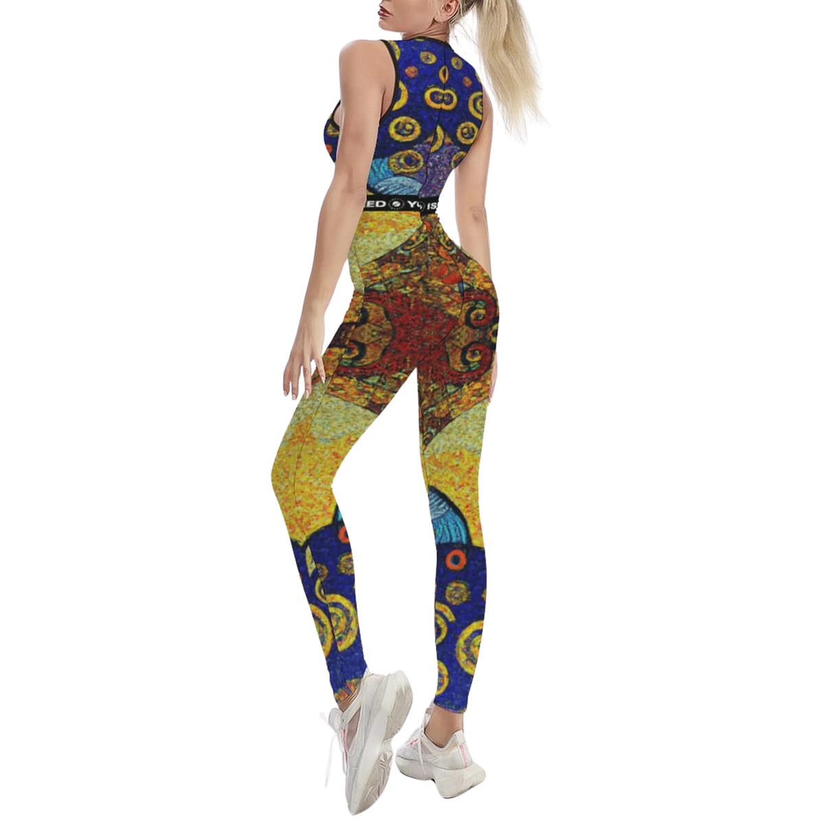 Sleeveless, patterned jumpsuit in vibrant colors, fitted body-contouring design, worn with white sneakers.