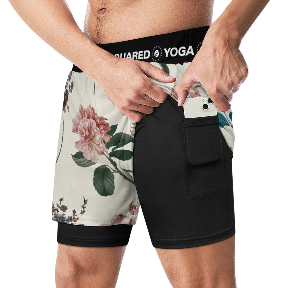 Compression yoga shorts featuring a floral pattern in light tones and a solid black bottom. Includes a side pocket for a phone.
