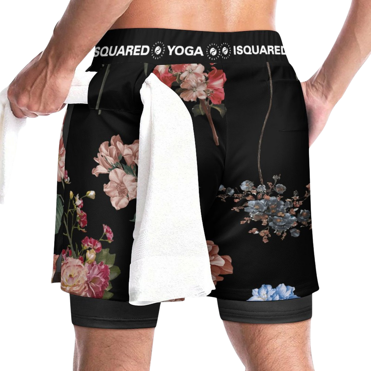 Compression yoga shorts in a floral print with a black background, featuring a towel draped at the waist.