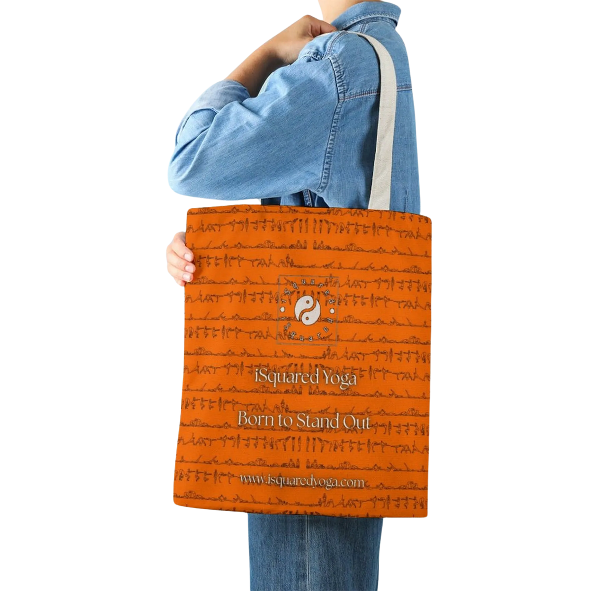 Orange tote bag featuring a yoga-themed print, held by a model in a denim jacket with cream straps.