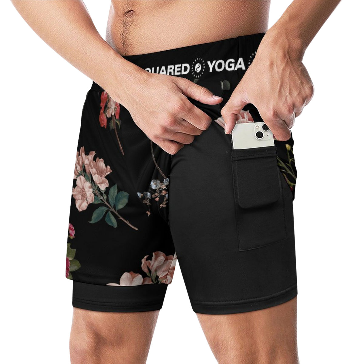Compression yoga shorts feature a floral design and a solid black back, with a pocket for a phone.
