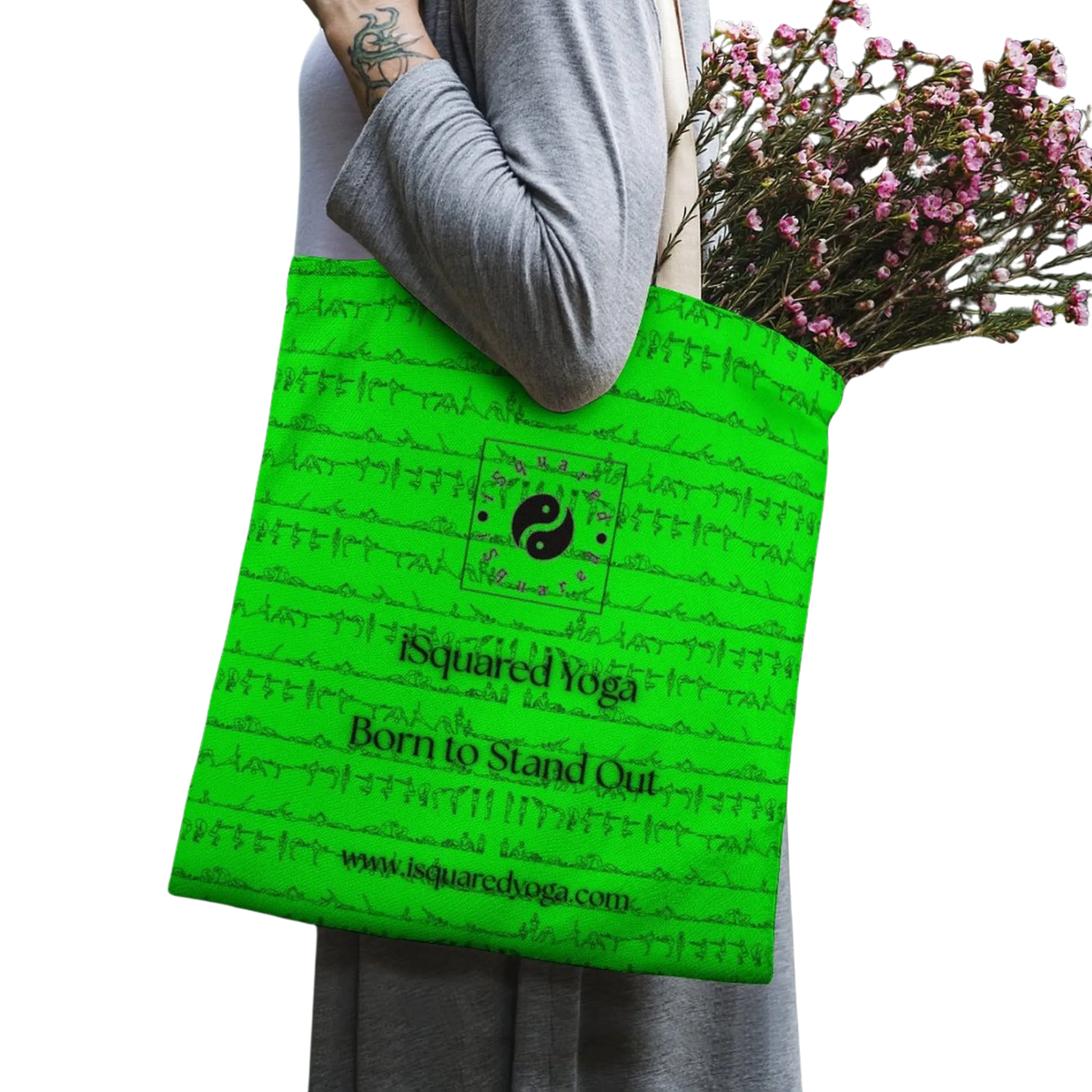 Bright green iSquared Yoga tote bag with intricate print design, featuring soft straps and held by a model carrying flowers.