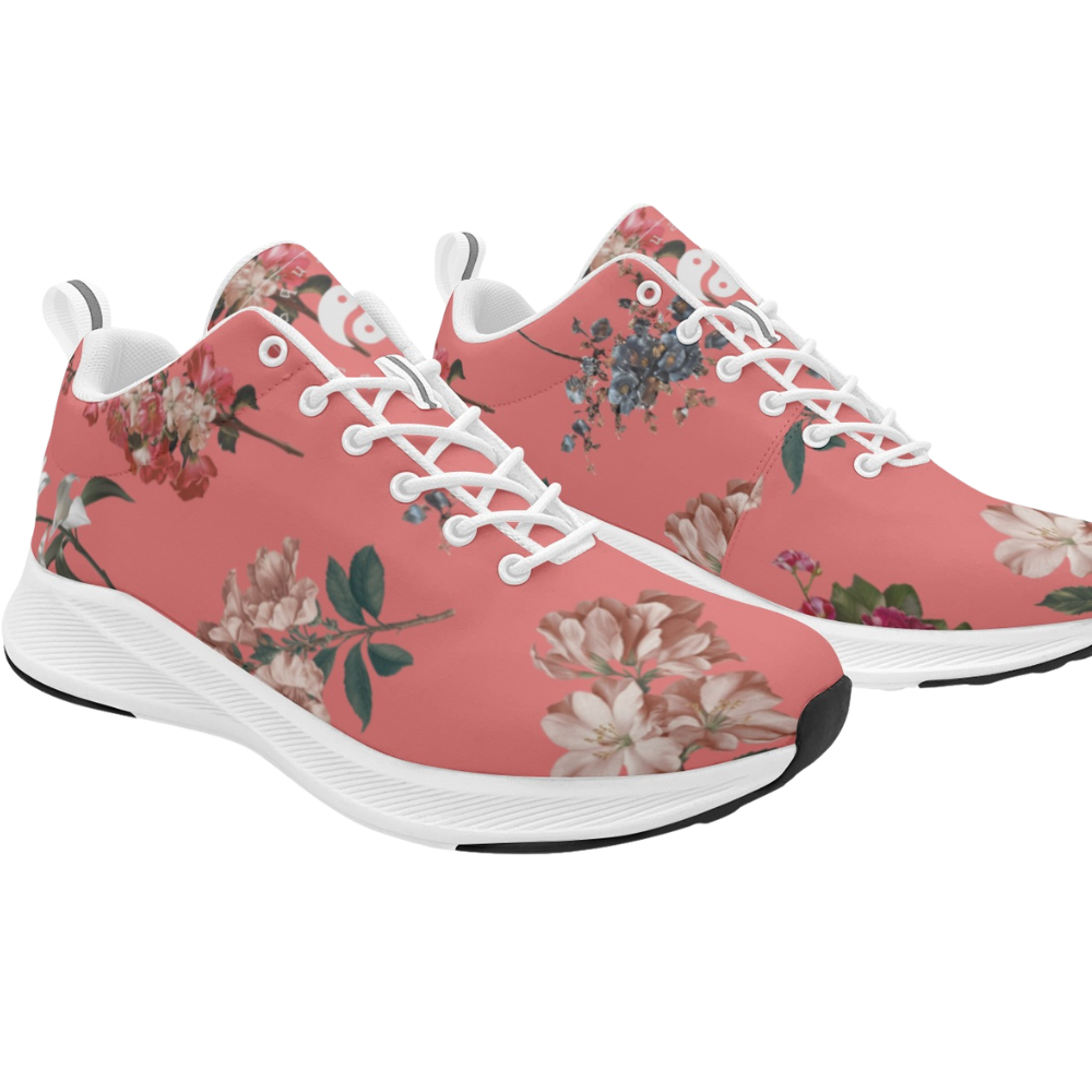 Pink sneakers featuring a floral pattern with white laces and soles, designed for casual and active wear.