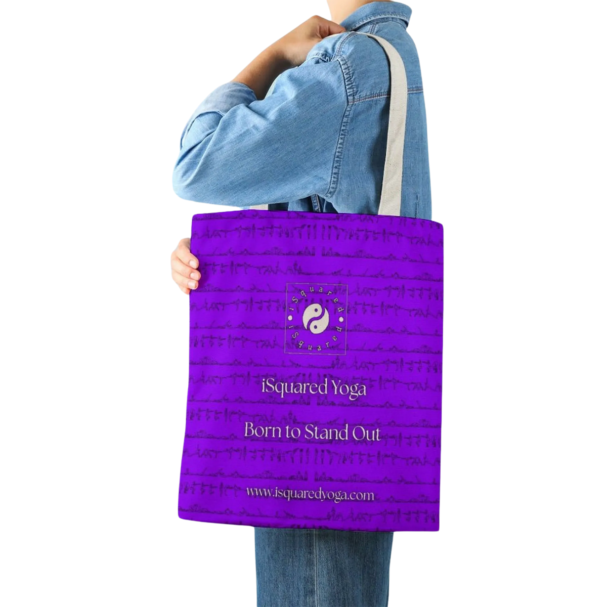 Purple tote bag with double-sided print, featuring the iSquared Yoga logo and text "Born to Stand Out," worn over the shoulder.