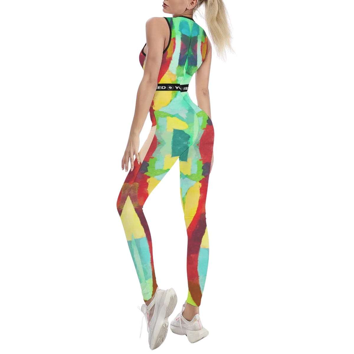 Sleeveless, multicolored jumpsuit featuring a body-contouring fit, paired with white athletic shoes.