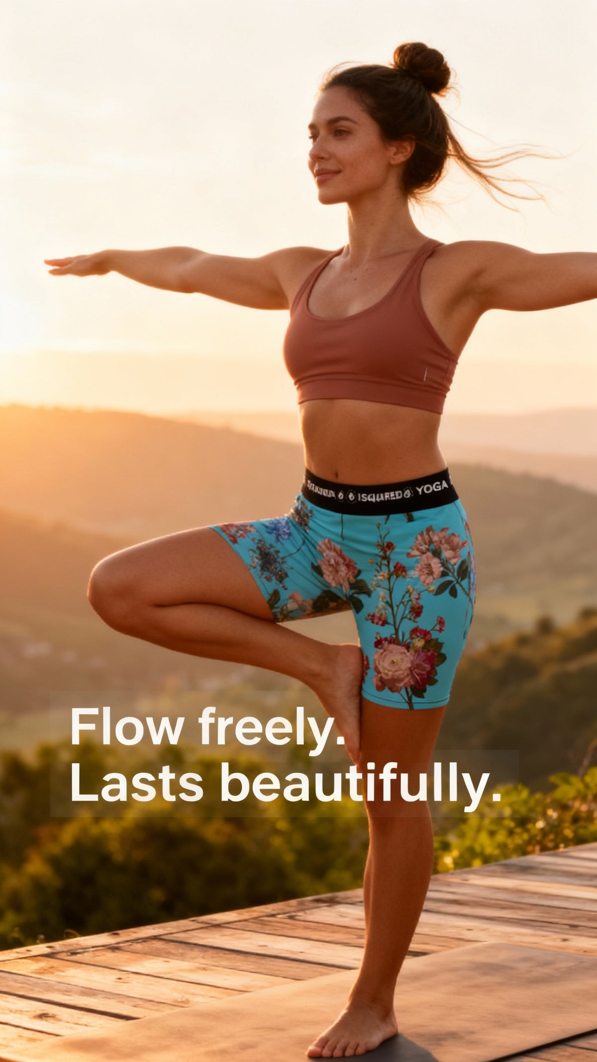 Unisex iSquared Yoga Shorts in vibrant turquoise with floral print, worn by a model demonstrating a yoga pose outdoors.