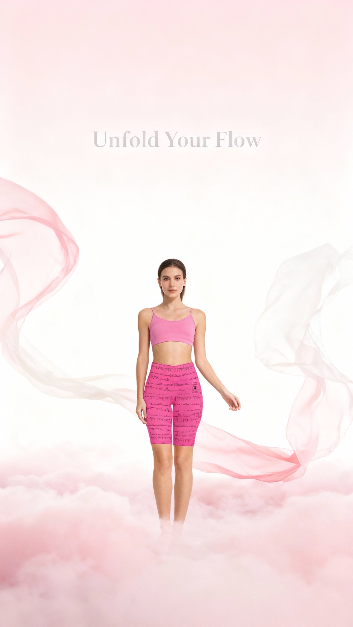 High-waisted, pink Bikram Series iSquared Maureen Shorts with a biker length, stylishly paired with a matching crop top.