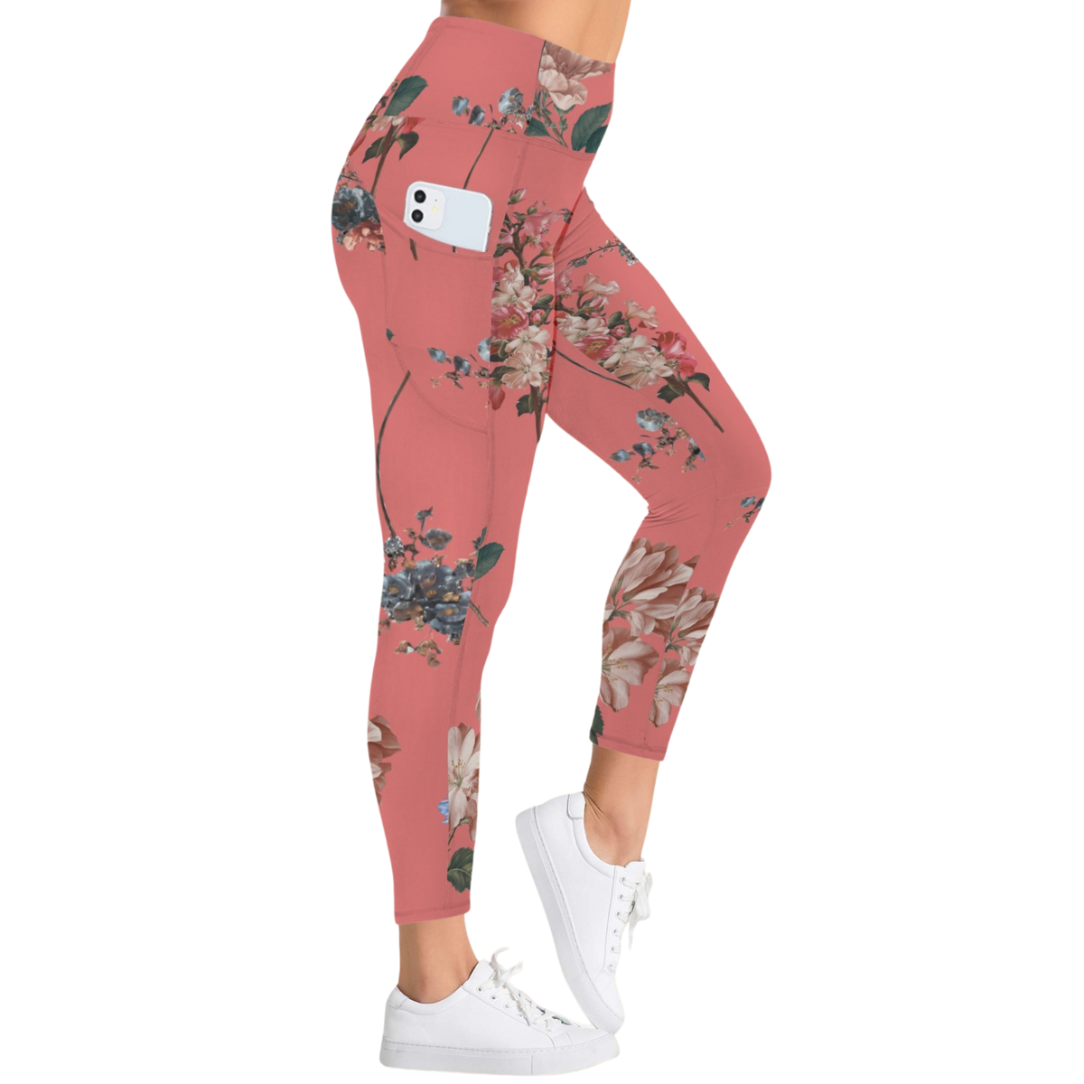 Floral pattern leggings in vibrant coral, featuring a high-rise waist and side pockets, worn with white sneakers.