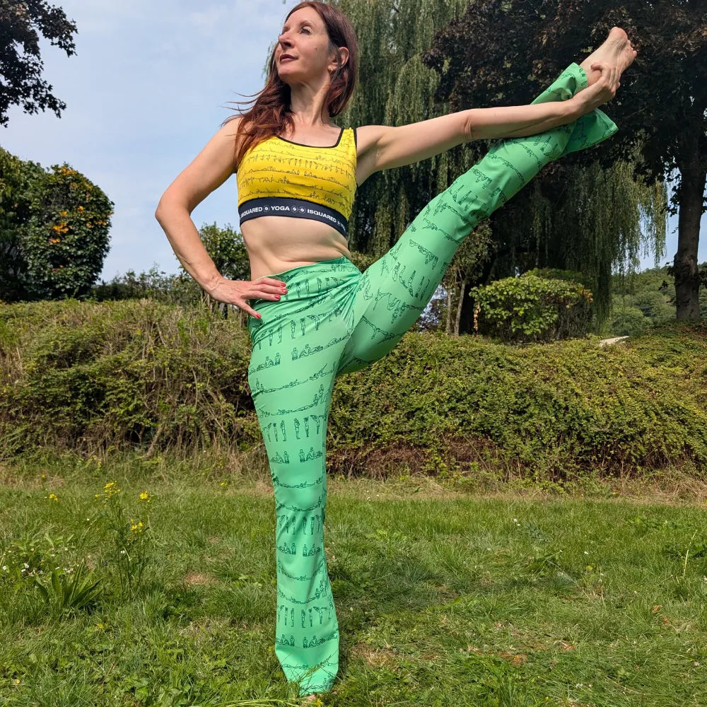 Cross waisted flare leggings in cream with a black yoga pose print, featuring a sculpted V seam for flattering fit.