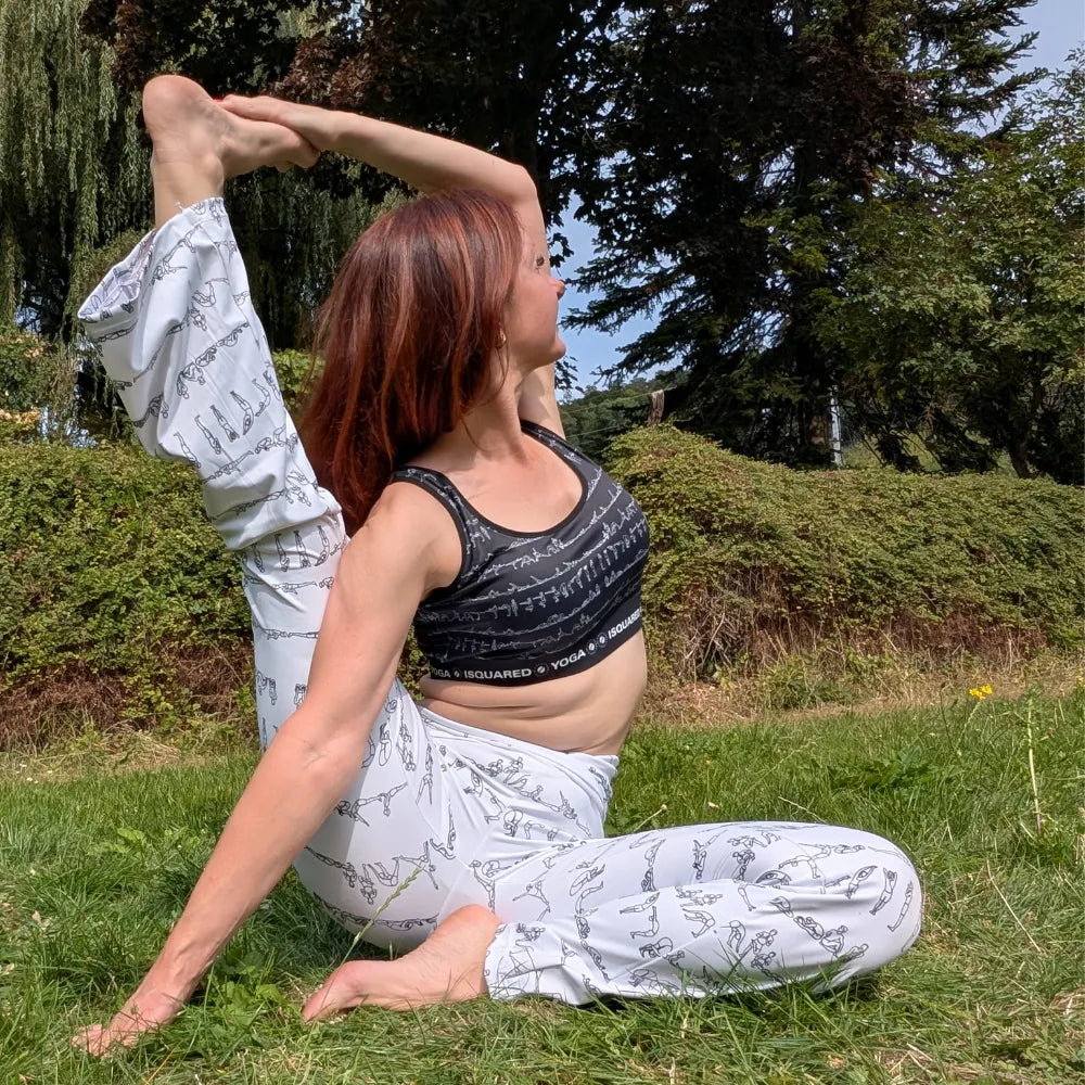 Bikram Series Cross Waisted Flair Leggings with a white base and black yoga pose print, featuring a crossover waistband and flare leg.