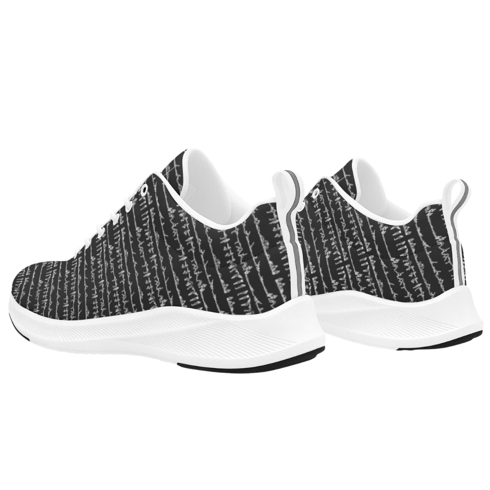 Black and white patterned iSquared Women Runners with a sleek design and white rubber soles, showcasing a modern look.