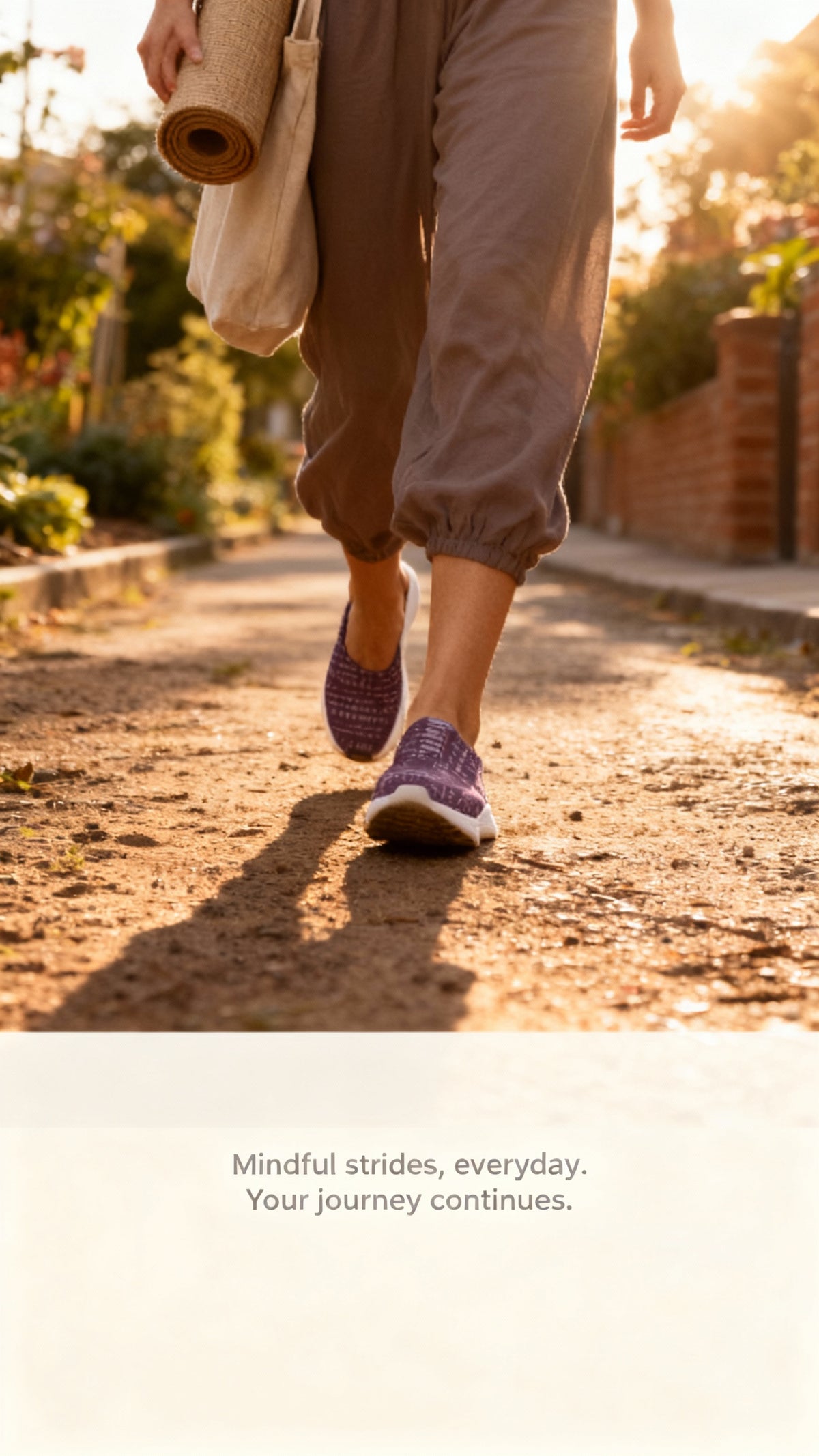 Purple iSquared Runners worn by a person in loose gray pants, walking on a dirt path with a yoga mat and bag in hand.