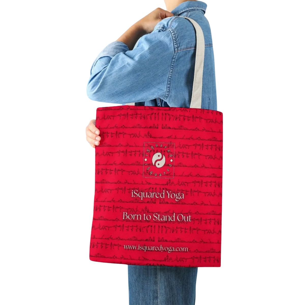 Red iSquared Tote Bag featuring a subtle yoga posture print, held by a person wearing a denim jacket.