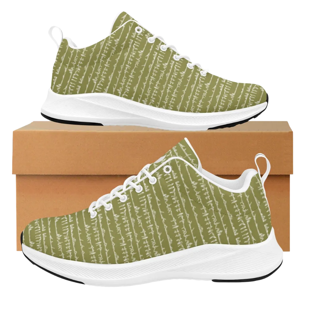 Bikram Ember iSquared Women Runners in olive green with a textured pattern, set on a cardboard shoe box.