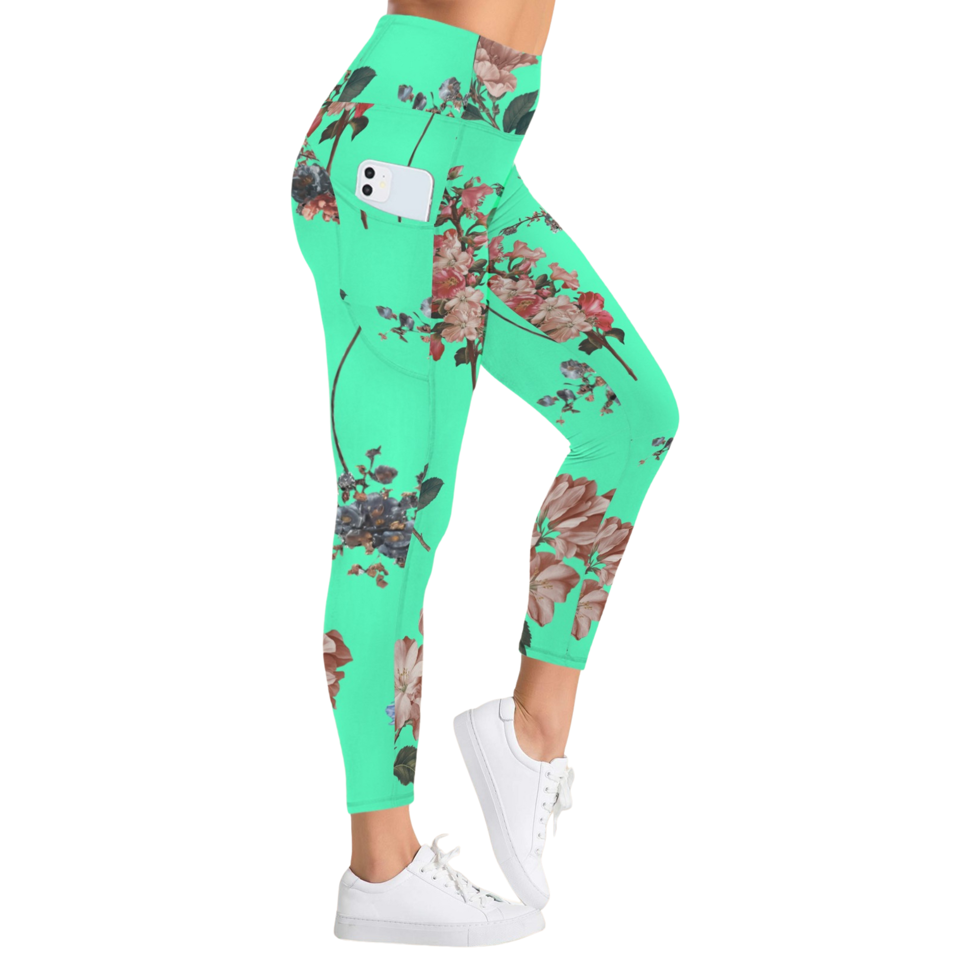 Vibrant turquoise pocket leggings with floral print, high-rise fit, worn with white sneakers.