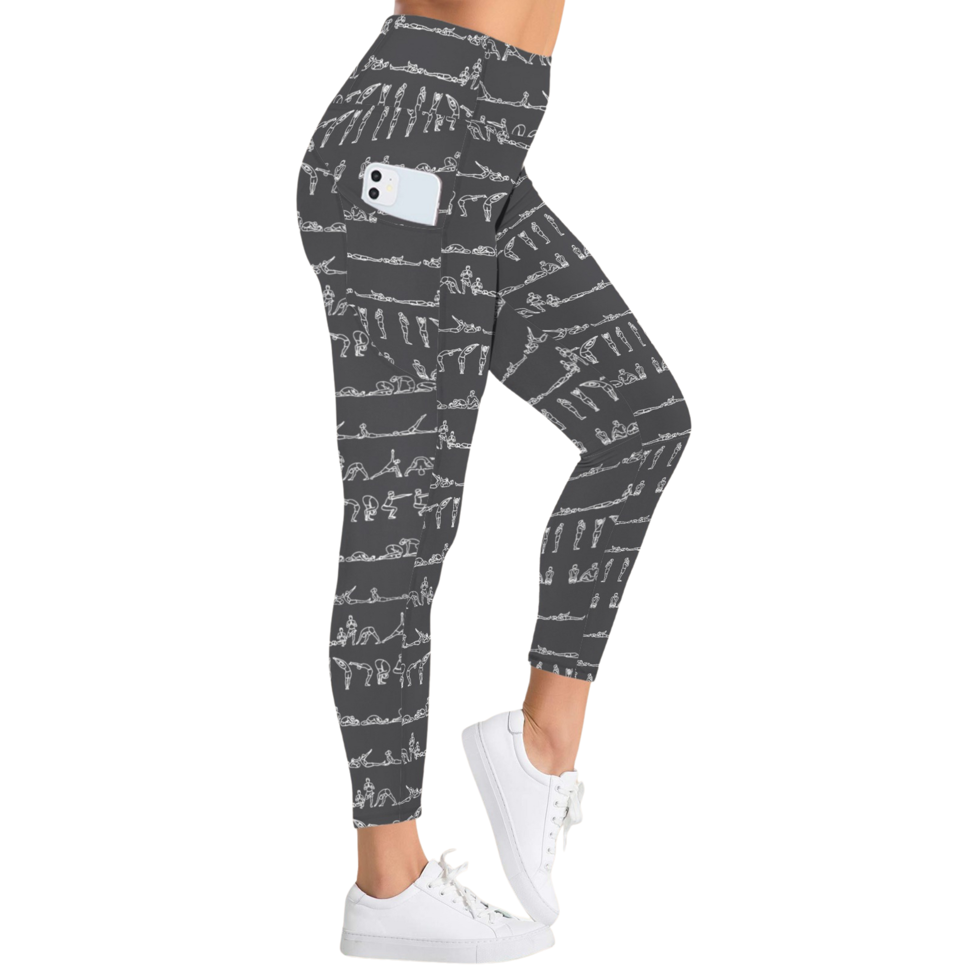 High-rise black leggings featuring white yoga pose graphics, side pockets, and a snug fit, worn with white sneakers.